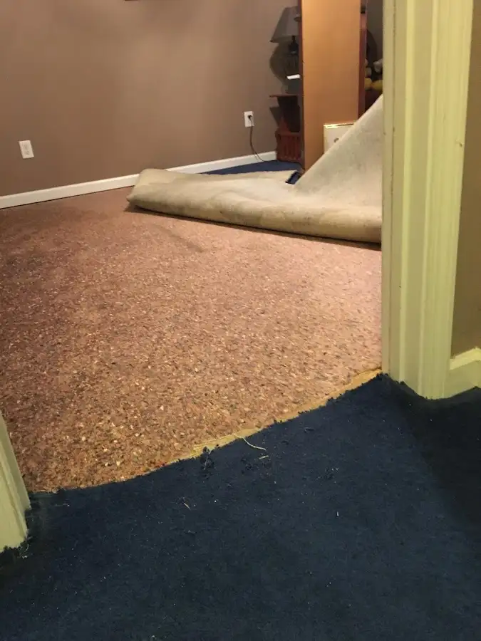 Carpet pad removal revealing water damage during Water Mitigation Services in Shelley